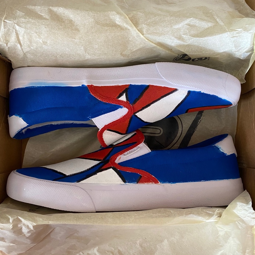 Hand painted red white and blue slip on shoes.